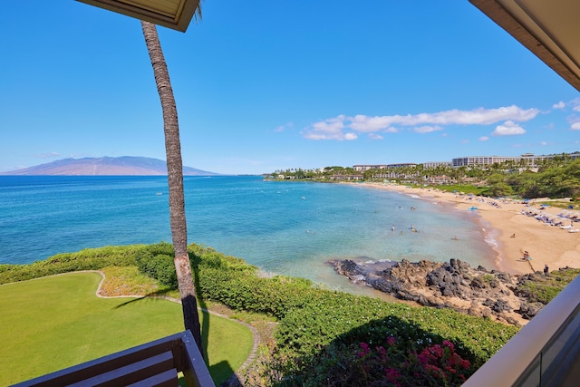 water view featuring a mountain view and a beach view