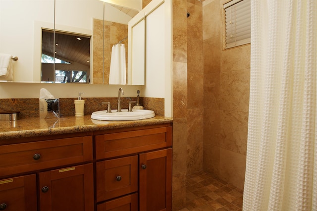 bathroom with vanity and curtained shower