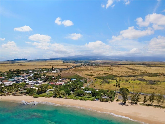 aerial view with a water view and a view of the beach