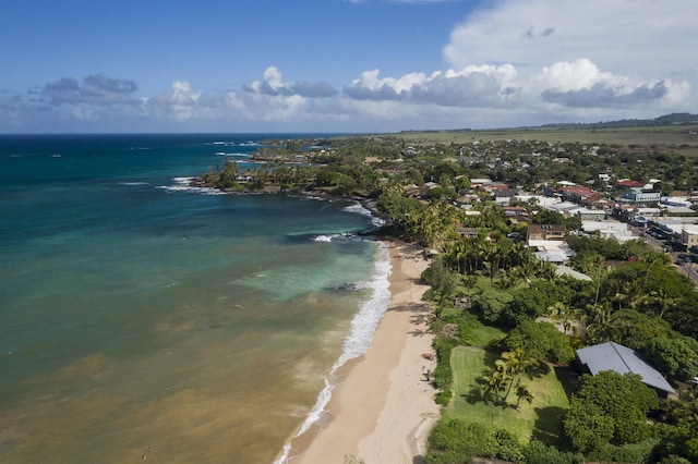 aerial view featuring a view of the beach and a water view