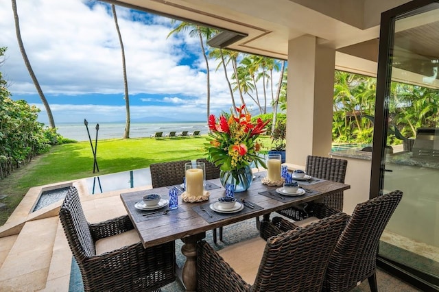 view of patio / terrace with a water view