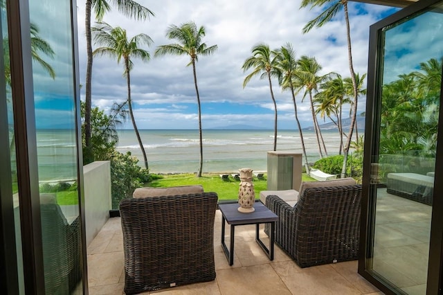 balcony with a view of the beach and a water view