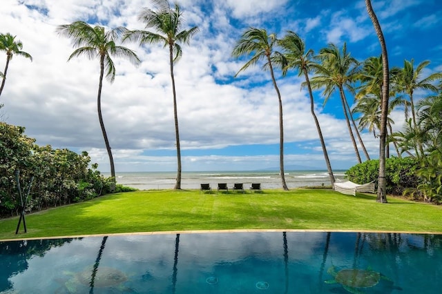 exterior space featuring a water view and a yard