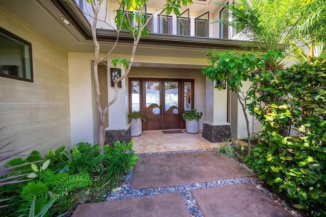 entrance to property featuring french doors and a porch