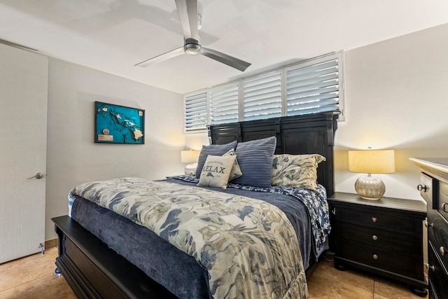 bedroom featuring light tile patterned flooring and ceiling fan