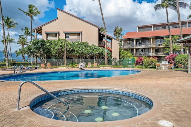 view of pool featuring a community hot tub