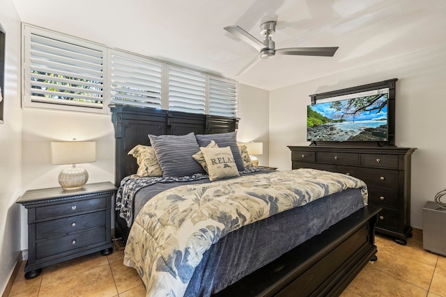 tiled bedroom with ceiling fan