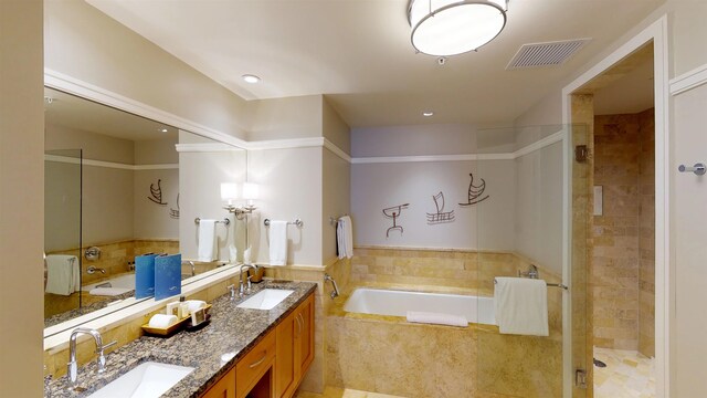 full bath featuring a sink, visible vents, and a bath