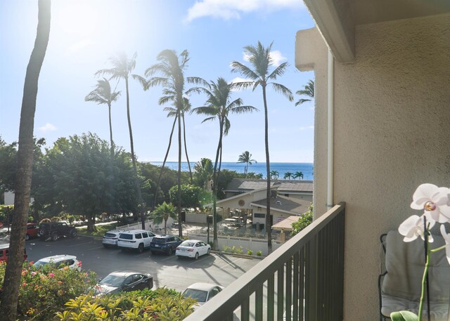 balcony featuring a water view