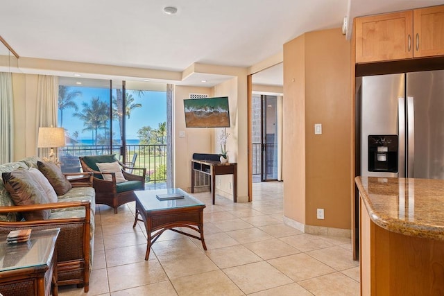 living room with light tile patterned floors and baseboards