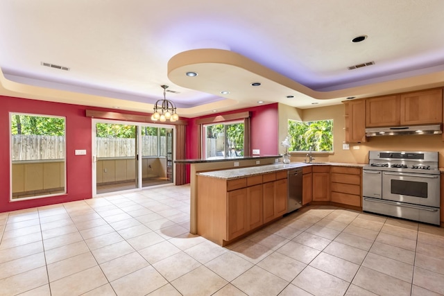 kitchen featuring a raised ceiling, visible vents, under cabinet range hood, and stainless steel appliances