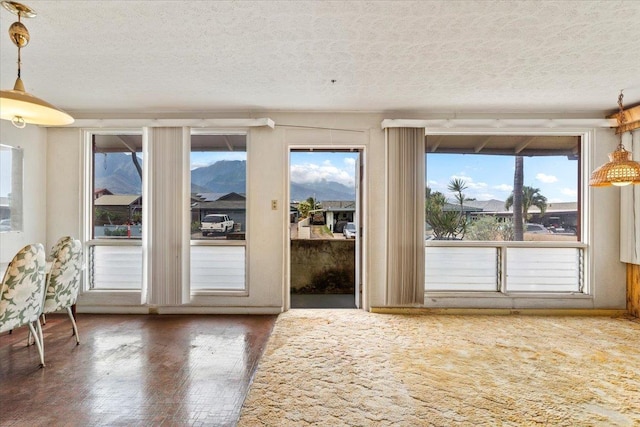 entryway with a textured ceiling