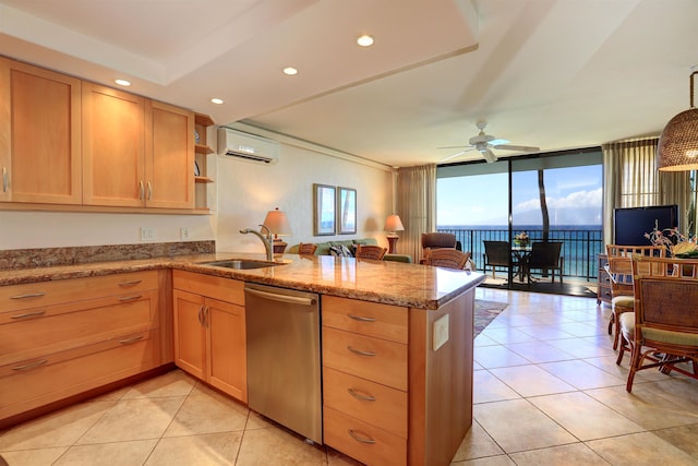 kitchen with a wall of windows, kitchen peninsula, dishwasher, ceiling fan, and sink