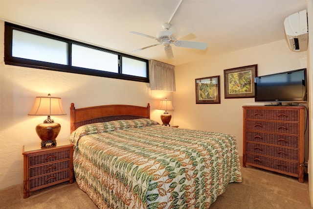 carpeted bedroom featuring ceiling fan and an AC wall unit