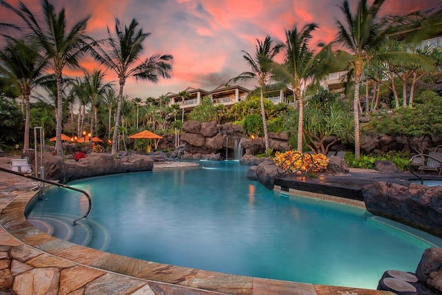 view of pool at dusk