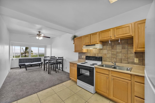 471 Liholiho St Unit 23, Wailuku, HI 96793 - kitchen featuring range with electric stovetop, under cabinet range hood, light carpet, light countertops, and backsplash