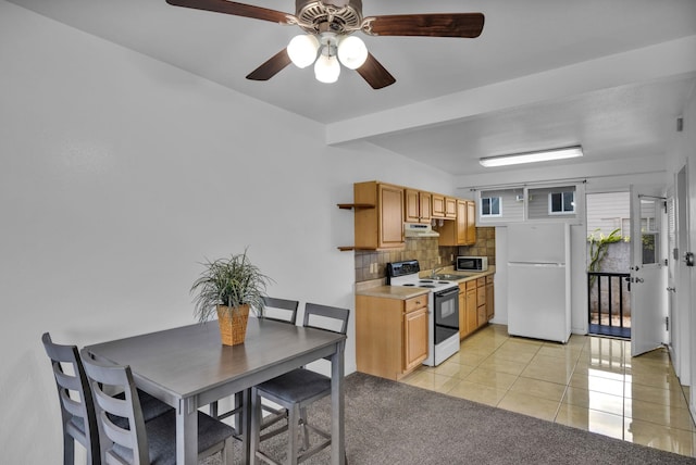 471 Liholiho St Unit 23, Wailuku, HI 96793 - kitchen with electric stove, freestanding refrigerator, tasteful backsplash, light tile patterned floors, and light countertops