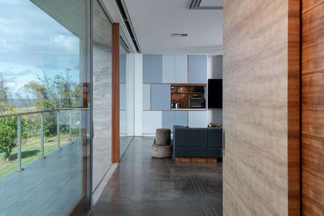 hallway featuring a wall of windows