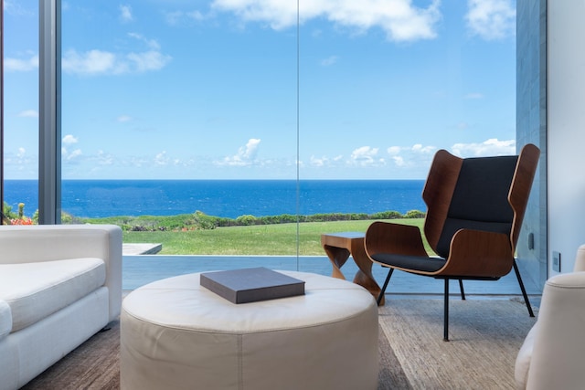 view of patio with a water view and a balcony