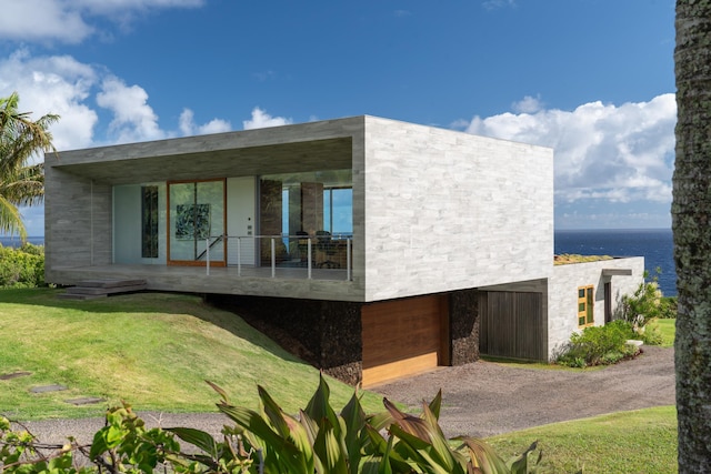 exterior space featuring a front yard and a water view