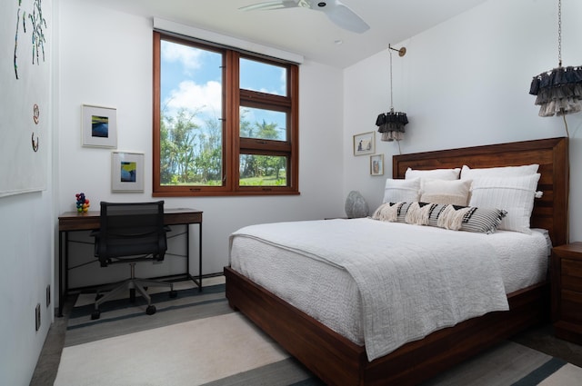 bedroom with ceiling fan and multiple windows