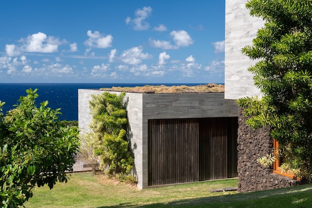 view of outbuilding featuring a water view