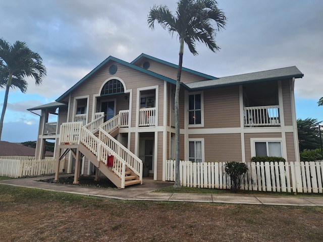 rear view of property with a balcony