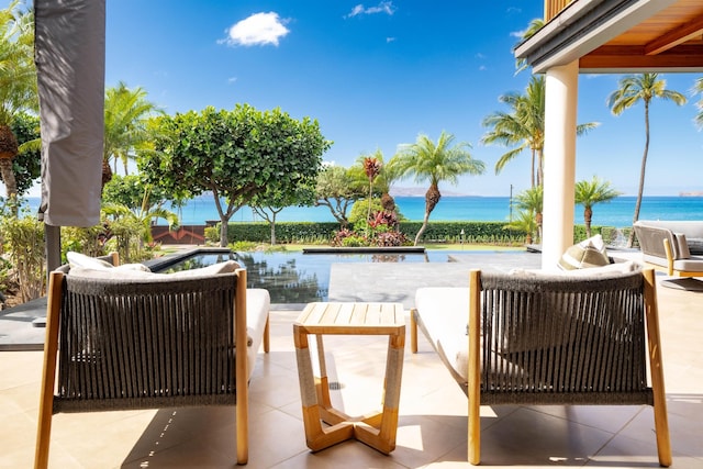 view of patio / terrace with a water view and an outdoor hangout area