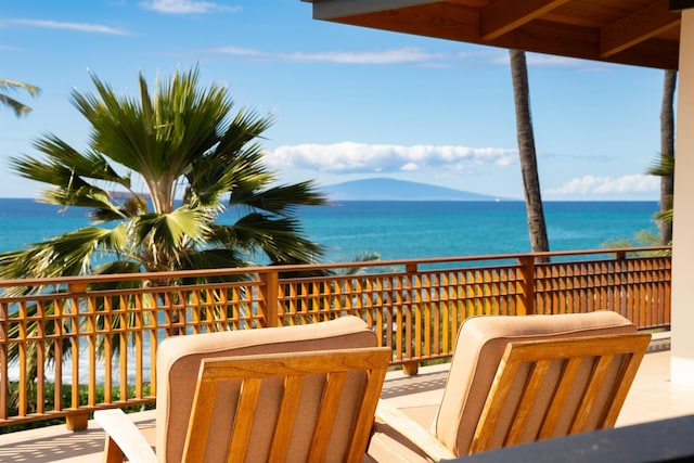 balcony featuring a water view