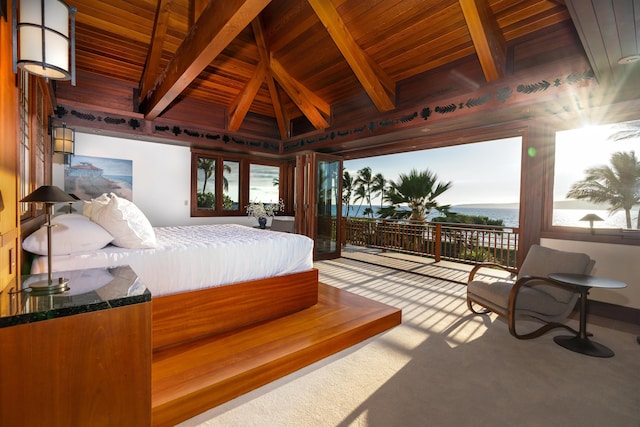 carpeted bedroom featuring multiple windows, lofted ceiling with beams, a water view, and wooden ceiling