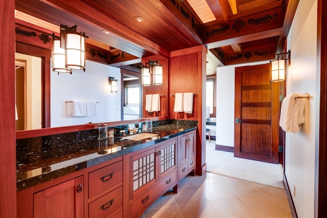 bathroom featuring beam ceiling, tile patterned flooring, vanity, and wood ceiling