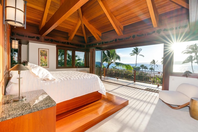 carpeted bedroom featuring access to exterior, lofted ceiling with beams, a water view, and wooden ceiling