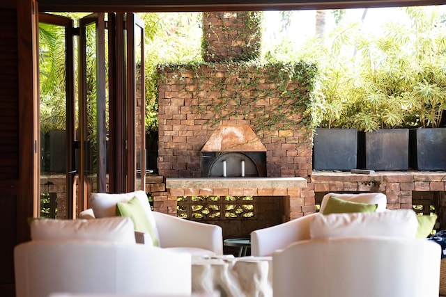 view of patio / terrace featuring an outdoor living space with a fireplace