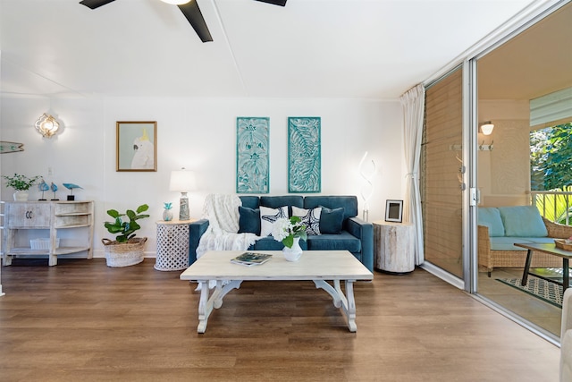 living room featuring hardwood / wood-style flooring and ceiling fan