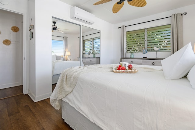 bedroom featuring ceiling fan, a closet, dark hardwood / wood-style floors, and a wall mounted air conditioner