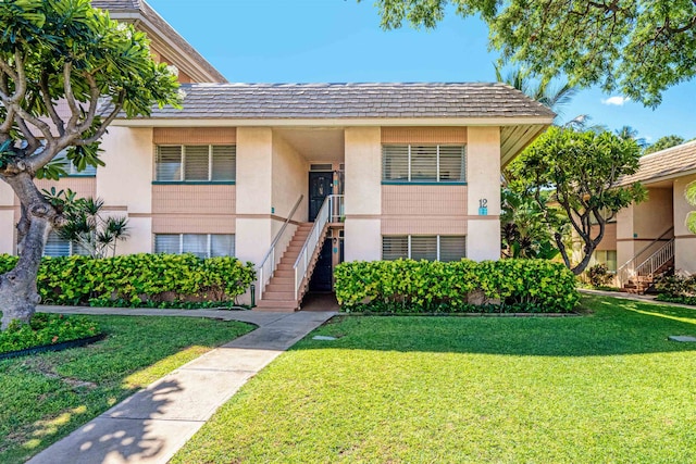 view of front of home with a front yard