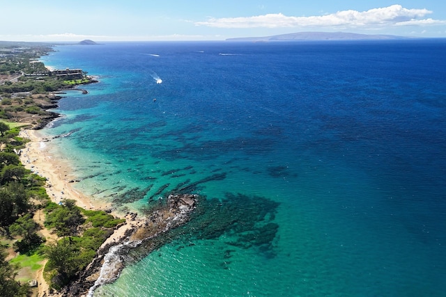 aerial view featuring a water and mountain view