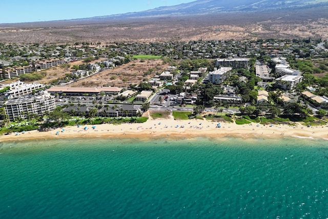 bird's eye view featuring a beach view and a water view