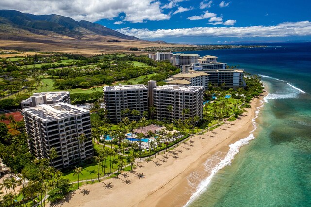 aerial view featuring a beach view and a water and mountain view