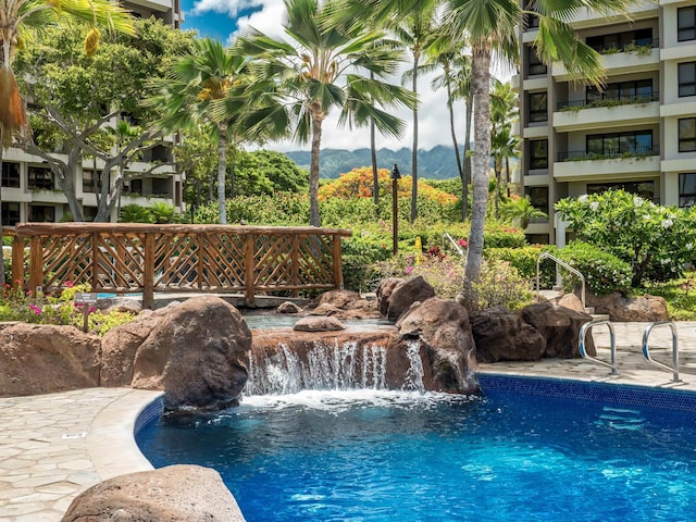 view of pool featuring pool water feature and a mountain view