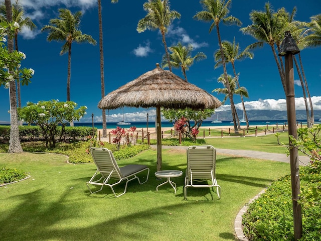 view of property's community featuring a gazebo, a yard, and a water view