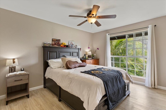 bedroom featuring light hardwood / wood-style flooring and ceiling fan