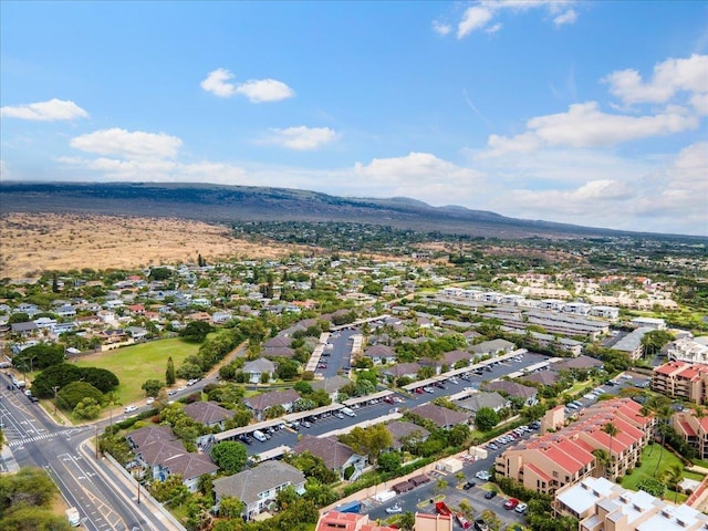 drone / aerial view featuring a residential view and a mountain view