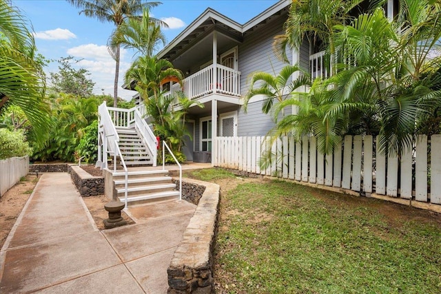 surrounding community featuring stairs and fence