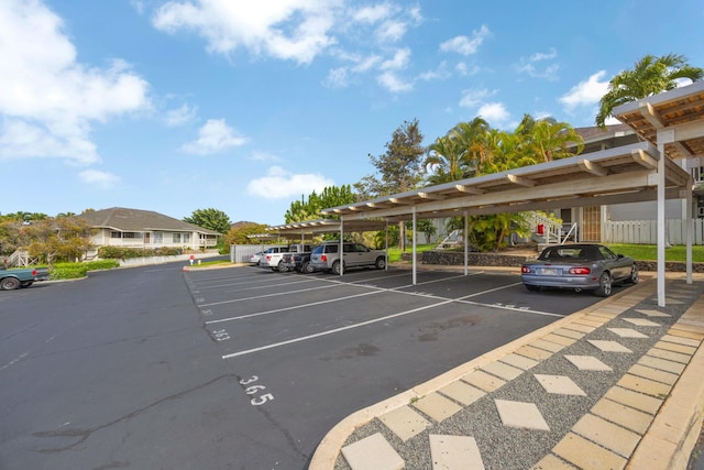 view of partially covered parking lot