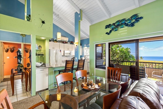 10 Wailea Ekolu Pl Unit 1008, Kihei, HI 96753 - dining area with high vaulted ceiling, beam ceiling, light tile patterned floors, and a water view