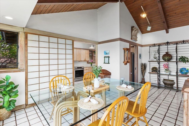 tiled dining room featuring beam ceiling, high vaulted ceiling, and wood ceiling