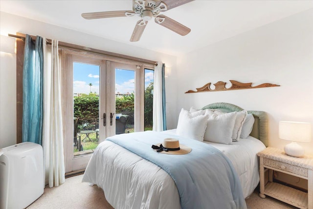 bedroom with french doors, light colored carpet, ceiling fan, and access to outside