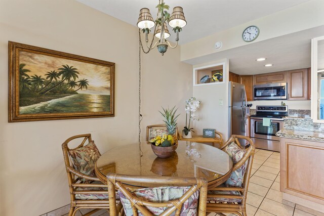 3723 Lower Honoapiilani Rd Unit 302, Lahaina, HI 96761 - dining space featuring a chandelier and light tile patterned floors