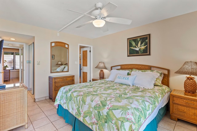 tiled bedroom featuring ceiling fan